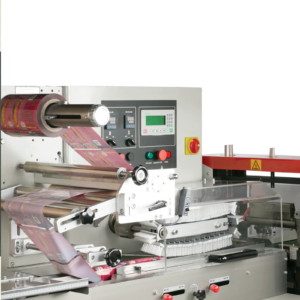 El área de envasado y sellado en un sistema automático de flow pack HFFS. El soporte del rollo de film está equipado con un rollo de film de embalaje rojo, enhebrado a través de la máquina y listo para usar. Se muestra el logotipo industrial de JORES TECHNOLOGIES® y una leyenda que dice software fácil de usar con pantalla táctil.