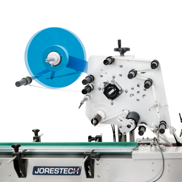 Primer plano del ala para colocar el rollo de etiquetas del aplicador automático de etiquetas JORES TECHNOLOGIES® para envases planos, Omicron 3