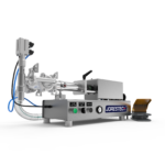 Máquina de llenado por pistón de baja viscosidad para mostrador de JORES TECHNOLOGIES®. El llenador por pistón está fabricado en acero inoxidable y hay un pedal amarillo y gris apoyado al costado.