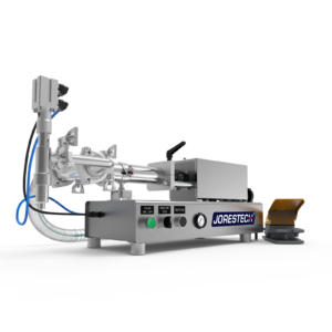 Máquina de llenado por pistón de baja viscosidad para mostrador de JORES TECHNOLOGIES®. El llenador por pistón está fabricado en acero inoxidable y hay un pedal amarillo y gris apoyado al costado.