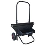 Vista diagonal de un carrito dispensador negro JORES TECHNOLOGIES® para flejado de acero manual para pallets, correa de acero