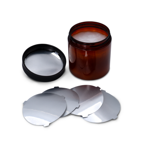 Posición del liner de inducción con pestañas dentro de la tapa antes de ser sellado