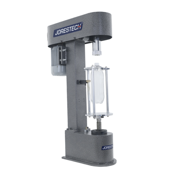 Tapadora semiautomática para botellas con logo azul de JORES TECHNOLOGIES® en el lateral y botella de plástico transparente
