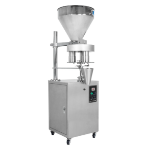 El llenador volumétrico semiautomático de acero inoxidable JORES TECHNOLOGIES® para productos granulares de flujo libre en vista diagonal sobre