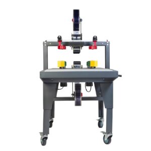 máquina selladora de cajas gris con tracciones laterales amarillas