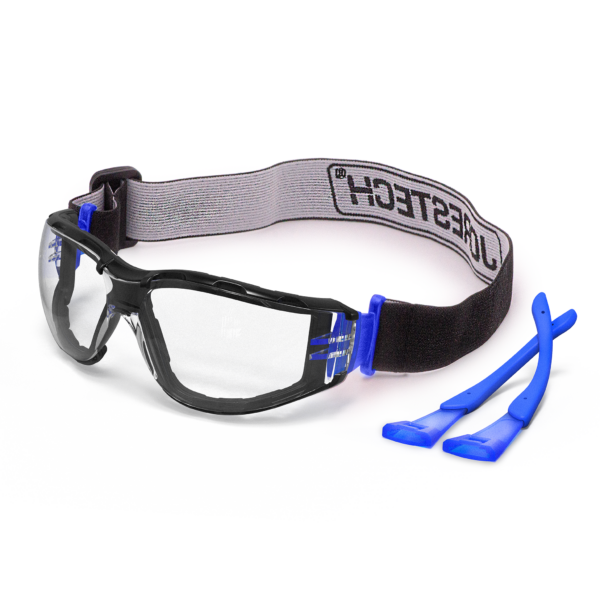 Vista diagonal de las gafas de seguridad JORESTECH antiempañamiento, conformes con ANSI, convertibles en gafas tipo goggles con sello de espuma desmontable, patillas y banda para la cabeza. Las gafas tienen la correa elástica instalada y las patillas azules están en el lado derecho