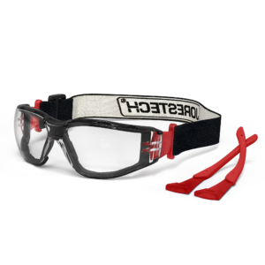 Vista diagonal de las gafas de seguridad antiempañantes JORESTECH convertibles en goggles con junta de espuma desmontable, patillas y cinta para la cabeza. Las gafas tienen la correa elástica instalada y las patillas rojas están en el lado derecho.