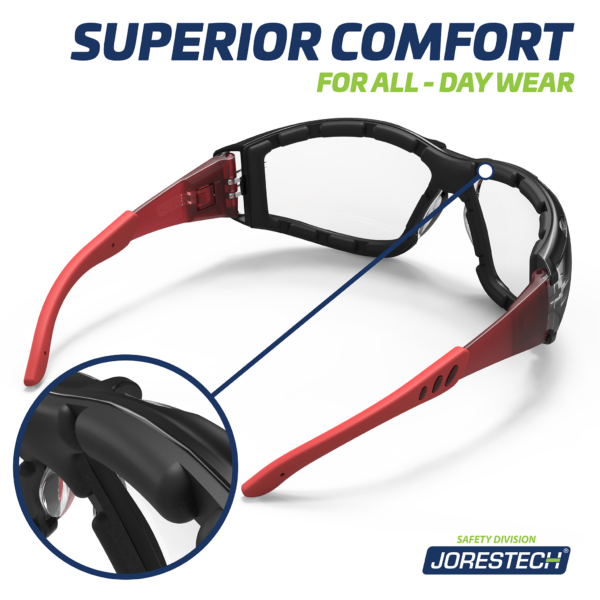 Muestra una vista de la parte trasera de las gafas de seguridad antivaho JORESTECH rojas y transparentes convertibles en goggles, con patillas desmontables y banda elástica para la cabeza. Se muestra en un círculo un primer plano de la junta de espuma y el texto dice comodidad superior para usar durante todo el día.