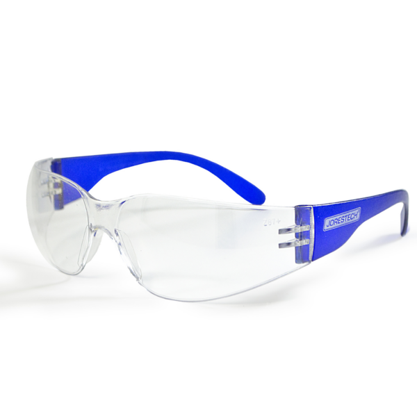 Presenta unas gafas JORESTECH de alto impacto con lentes de policarbonato transparentes y patillas azules sobre fondo blanco.