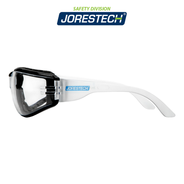 Vista lateral de las gafas de seguridad transparentes JORESTECH ANSI Z87+ para protección de alto impacto con junta de espuma negra, sobre fondo blanco.
